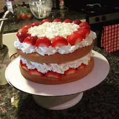 two layered cake with strawberries on top