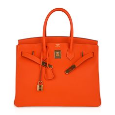 Hermes Birkin 35 bag featured in Feu Orange - a fresh take on the the iconic classic.Rich with gold hardware.Hermes leather in Togo is textured to be scratch resistant.This classic orange Birkin bag is the perfect addition to any Hermes handbag collection.Comes with lock, keys, clochette, sleeper, raincoat and signature Hermes box.NEW or NEVER Unparalleled for 21 years in trust, integrity and service, mightychic offers a beautiful selection of Hermes at your fingertips.final sale BAG MEASURES:LENGTH 35cm / 14" TALL 28cm / 11"DEEP 18cm / 7" HANDLES:TALL 5"CONDITION:NEW or NEVER PLEASE NOTE: Hermes bag payments require bank wire transfer unless arrangements are made prior to purchase Will be delivered with Box, dust bag, card, booklet and receipt Exchange Accepted in this cases :/p> Orange Birkin, Hermes Birkin 35, Handbag Collection, Hermes Handbags, Hermes Bag, Hermes Birkin, Birkin Bag, High Quality Leather, Bag Sale