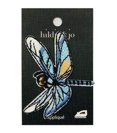 a blue and yellow dragonfly with the words, hold on to it's wings