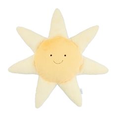 a yellow stuffed star with a smiling face