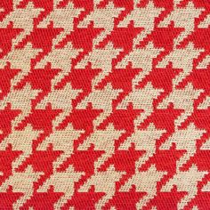 a red and white houndskin pattern on fabric