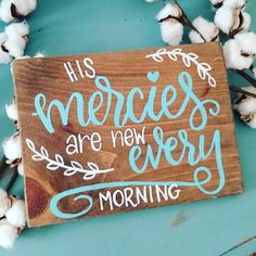 a wooden sign that says, his mercies are new every morning with cotton in the foreground