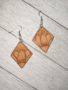 Earrings are lightweight and hand tooled from scratch. Finished product may vary slightly from the picture due to its handmade nature. Earrings are finished with silver earring hooks for easy wearing. Brown Flower Drop Earrings, Adjustable Beige Earrings For Everyday, Beige Leather Jewelry, Hand Tooled Brown Earrings For Everyday Wear, Brown Hand Tooled Everyday Earrings, Brown Earrings For Everyday Use, Everyday Brown Faux Leather Jewelry, Tooled Leather Earrings, Country Rings