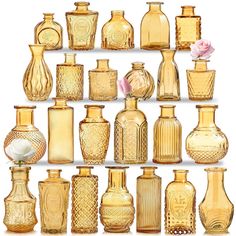 an assortment of glass vases and jars