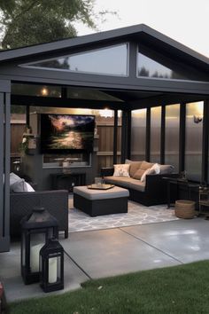 an outdoor living area with couches and tables