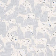 a blue and white wallpaper with elephants on it