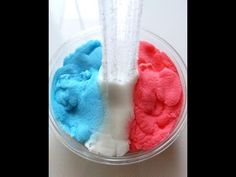 two different colored powders in a bowl with a blender on the top one is red, white and blue