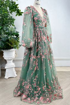 Indulge in the elegance of our Long Sleeves O Neck Pink Floral Embroidery Sage Tulle Dress. Adorned with intricate floral embroidery and crafted from delicate tulle, this dress exudes sophistication and charm. The long sleeves provide coverage while the O neck adds a touch of femininity. Perfect for special occasions and making a statement. Bust and Skirt with full lining. 100% Polyester 100% Recycled polyester lining Concealed zip at center back Imported Luxury Lavender Dress With Intricate Embroidery, Floral Lace Green Dress, Formal Dresses Long Embroidered, Luxury Long Dress With Floral Embroidery, Luxury Floor-length Embroidered Dress For Formal Occasions, Fitted Green Gown With Floral Applique, Green Wedding Gown With Floral Applique, Elegant Green Gown With Floral Embroidery, Green Floral Applique Wedding Gown