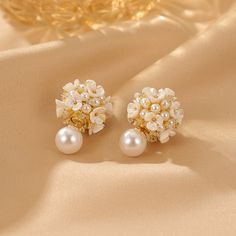 ✦ Indulge in the romance of our elegant stud earrings adorned with a delicate flower pearl design, perfect for adding a touch of grace to your wedding ensemble or elevating your bridesmaid look. Crafted with meticulous detail, these earrings encapsulate the essence of romance, making them an ideal choice for those special occasions. The timeless appeal of the flower pearl design adds a subtle and sophisticated charm, making these earrings a versatile accessory for various elegant events. Whether Feminine Pearl White Drop Bridal Earrings, Pearl Drop Flower-shaped Bridal Earrings, Elegant Pearl Button Earrings For Wedding, White Pearl Button Earrings For Wedding, Formal Pearl White Flower Drop Earrings, Formal Pearl White Flower Earrings With Pearl Drop, Feminine Pearl Flower Earrings For Weddings, White Feminine Pearl Earrings For Formal Occasions, Feminine Flower-shaped Pearl Earrings For Weddings