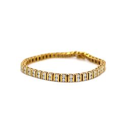 This breathtaking 5 Carat Bar Set Diamond Tennis Bracelet in 14k Yellow Gold is the perfect gift for a special occasion. The elegant and sporty bracelet features eighty-eight (88) .056 carat round brilliant cut diamonds. The diamonds are set in pairs in-between stylish 14 karat yellow gold channel bars. Geometric, sparkling, and expertly designed. The bracelet measures 7.52 inches long. A modern beauty in diamonds and yellow gold! Pair with some diamond earrings to complete the look! Luxury Yellow Gold Diamond Tennis Bracelet, Formal Diamond White Channel Set Bracelet, Modern Channel Set Diamond Bracelet For Anniversary, Classic Channel Set Diamond Bracelet, Formal Diamond Tennis Bracelet Channel Set, Classic Diamond Tennis Bracelet With Channel Set, Luxury Diamond Tennis Bracelet With Channel Set, Classic Diamond Tennis Bracelet Channel Set, Luxury Diamond Channel Set Tennis Bracelet