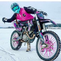 a person on a dirt bike in the snow