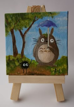 a painting of a totoro holding an umbrella in front of a black spider