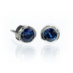 Simple blue sapphire bezel set stud earrings. SAPPHIRE: Lab-created blue sapphires or genuine mined blue sapphires 3.5mm or 4mm Round Faceted cut (other sizes available upon request) Select from 2 grades of genuine sapphires: Grade A: Medium to dark navy, little or no color zoning; slightly included; good brilliance; good cut; good polish Grade AA: Medium navy to royal blue; eye clean; good brilliance; good cut; good polish The studs measure 5.5mm diameter with the 4mm sapphires. Pictures show 4 Sapphire Birthstone Earrings For Formal Occasions, Formal Sapphire Earrings With Birthstone, Formal Sapphire Birthstone Earrings, Elegant Blue Jewelry With Bezel Setting, Modern White Gold Earrings With Bezel Setting, Modern Bezel Set Earrings For Formal Occasions, Modern Sapphire Earrings For Formal Occasions, Modern Formal Earrings With Bezel Setting, White Gold Sapphire Birthstone Earrings