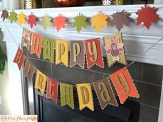 a happy birthday banner hanging from a fireplace