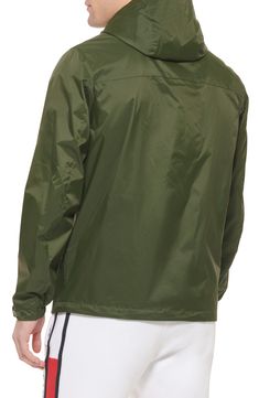 Stay dry in this lightweight nylon rain jacket featuring an attached hood and convenient zipper pockets. Fit: this style fits true to size.- Attached hood with toggle adjustment- Stand up collar- Long sleeves- Front hidden zip and hook-and-loop closure- 2 front zip slash pockets- Toggle hem- Woven construction- Mesh lining- Approx. 29" length (size M)- Imported Model's stats for sizing:. Height: 6'1". Suit: 40R. Waist: 30". Inseam: 32" Model is wearing size M. Dry Clean Shell: 100% nylon Lining: Weatherproof Long Sleeve Nylon Track Jacket, Weatherproof Nylon Track Jacket With Long Sleeves, Long Sleeve Windbreaker With Ykk Zipper For Hiking, Casual Hiking Windbreaker With Ykk Zipper, Outdoor Nylon Hooded Jacket With Ykk Zipper, Nylon Moisture-wicking Hooded Jacket For Outdoor, Outdoor Nylon Hooded Jacket With Moisture-wicking, Casual Nylon Hooded Jacket With Moisture-wicking, Nylon Long Sleeve Hooded Jacket For Rainy Weather