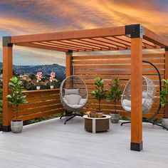 a wooden deck with two hanging chairs and a hammock chair on the top