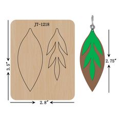 a wooden ornament with two leaves on it and the measurements for each one