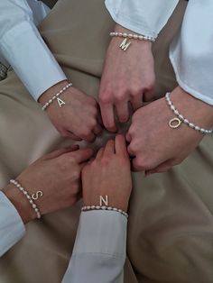 Looking for a special gift for bridesmaid for bachelorette party or wedding day? This dainty pearl bracelet is the epitome of refined elegance. Present her with a personalized token of your love, creating a connection that transcends the wedding day and becomes a cherished memory for years to come.  This personalized pearl bracelet features a beautiful golden-plated letter initial letter charm, adorned with sparkling cubic zirconia stones, that perfectly complements its elegant design.  makes it Elegant Bridesmaid Bracelets, White Pearl Drop Bracelets For Bridesmaids, White Pearl Drop Bracelet For Bridesmaids, Elegant Pearl Beaded Bracelets With Letter Beads, Pearl Bracelets For Bridesmaid Gift, Mother's Day Pearl White Pearl Bracelet, Elegant Bracelets With Letter Beads For Gifts, Elegant Letter Beads Bracelet For Gift, Pearl Bracelet With Letter Beads