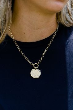 This 18k gold plated necklace features a vintage coin pendant, adding a touch of classic elegance to any outfit. Measuring 16 inches in length, it is handmade in Brazil, showcasing exceptional craftsmanship and timeless style. Perfect for layering or wearing on its own. Pairs with Liona ,Kindra and Sonya Earrings. Gold-tone Medallion Necklace With Coin Pendant, Vintage Yellow Gold Coin Necklace With Adjustable Chain, Elegant Coin-shaped Gold Chain Jewelry, Elegant Coin Shaped Gold Chain Jewelry, Elegant Gold Coin Chain Jewelry, Classic Yellow Gold Charm Necklace With Coin Pendant, Elegant Toggle Necklace With Round Coin Pendant, Gold Plated Coin Chain Necklace With Tarnish Resistance, Elegant Toggle Necklace With Coin Pendant