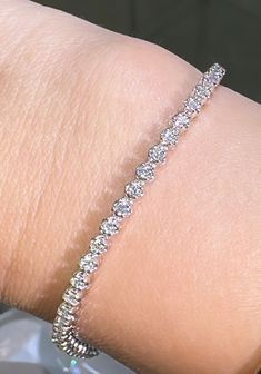 This beautiful Diamond Riviera Line Tennis Bracelet offers sparkling sophistication for any occasion with 1.95ct t.w. of dazzling diamonds, it will make you shine with undeniable elegance. Make your statement of style today! Metal: 14K White GoldDiamond Weight: Rounds Brilliant cuts 1.95ct t.w.Bracelet Length: 18cmLock: Box Catch With Hidden Safety Estimated production time is 4 - 5 weeks. Tennis Bracelet, Round Brilliant, Tennis, Sparkle, Diamonds, White Gold, Yellow Gold, Make Your, Bracelet