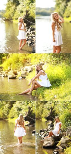 a woman in white dress sitting on rocks next to water and holding her hands behind her head