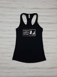 "Who else is obsessed with the office? These custom tops are perfect for your unique bachelorette party! Want \"(name) Bachelorette\" Underneath? Just add in the notes during checkout or request a custom order. Other colors available- Send me a message! THIS LISTING IS FOR TANK TOPS ONLY T-shirts available for the same price XS-XL. Please send me a custom order request -Tanks are racer-back tanks- Next Level brand- 60% combed ringspun cotton/40% polyester lightweight jersey. SUPER SOFT. These ta Fitted Black T-shirt For Bachelorette Party, Casual Cotton Tops For Bachelorette Party, Fitted Graphic Print Top For Bachelorette Party, Unique Bachelorette Party, Regional Manager, Bachelorette Tanks, Bff Shirts, Custom Top, Valentine Gifts For Husband