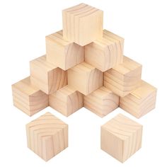 several wooden blocks stacked on top of each other with one block in the middle and four smaller ones at the bottom