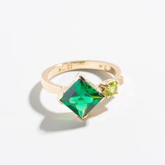 This cluster of standard-cut stones was re-imagined to evoke a message of the enduring beauty of the natural world. What one might perceive as mundane, the wearer can wield into hope and inspiration with their nurturing clarity. MATERIALS- Set in 14k solid gold- Featuring a cultivated Emerald & natural Peridot and Anniversary Jewelry With Si Clarity And Emerald Cut, Si Clarity Emerald Cut Jewelry For Anniversary, 14k Gold Crystal Ring With Si Clarity For Anniversary, Promise Jewelry With Multi-stone For May Birthstone, Green Crystal Promise Ring In Fine Jewelry Style, Green Multi-stone Promise Ring, Fine Jewelry Tsavorite Birthstone Ring, Green Cluster Rings In 14k Gold, Green Crystal Promise Ring Fine Jewelry