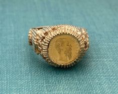 Fabulous gold ring. Maximiliano Emperador 1865 coin ring Circa 1970's. Gold is 9ct.  Current size is 7.5 (fits slightly larger due to shape). Sizing increases delivery time up to two weeks and is non returnable.  Happy to answer any questions pre purchase. Gross weght is 6.23dwt. Vintage Engraved Coin Signet Ring, Antique Coin-shape Engraved Signet Ring, Antique Coin Shaped Engraved Signet Ring, Antique Engraved Coin Signet Ring, Gold Coin-shaped Engraved Signet Ring, Gold Engraved Coin Signet Ring, Vintage 14k Gold Coin Ring, 14k Stamped Yellow Gold Coin Ring, Gold Coin-shaped Engraved Ring