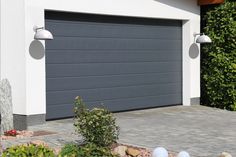 an image of a garage door in the driveway