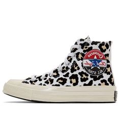 Looking for a stylish and eye-catching addition to your wardrobe? Look no further than the Chuck 70 Hi 'Logo Play' from Converse. This high-top sneaker features an all-over leopard print on the textile upper, giving it a bold and fashion-forward look. The traditional All Star patch on the medial ankle is complemented by a spliced and oversized version of the logo patch on the opposite side. The Off-White rubber midsole adds a vintage touch, while the Converse license plate at the back rounds out Hi Logo, Converse Off White, Logo Play, Converse Chuck Taylor 70, Chuck Taylor 70, White Chucks, Basket Sport, Vintage Converse, Leopard Sneakers