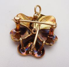 "This is an incredible antique piece from the Art Nouveau period. It is American made in Newark, New Jersey in the early 1900's by Crane & Theurer. This particular pin has been featured in designs by Eliane Fattal for S.J. Phillips in the \"Pensée\" collection. ( http://www.sjphillips.com/media/PhillipsSJphoto/pensee%20prices.pdf ) This collection was also featured in the October Issue of Town & Country Magazine. These pins are rare and incredibly collectible! The piece features a unique Art Deco Yellow Gold Collectible Brooches, Art Nouveau Yellow Gold Collectible Brooches, Country Magazine, Newark New Jersey, Pansy Flower, Pansies Flowers, Flower Brooch, American Made, Pansies