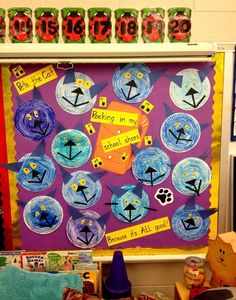 a bulletin board with paper plates on it