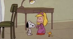 a cartoon character standing in front of a desk with a dog on the floor next to it