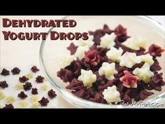 red and white food in a glass bowl with the words dehydrated yogurt drops