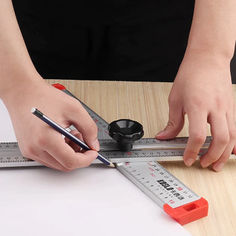 a person is using a ruler to measure something