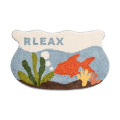 a bath mat with an image of a fish in the water and words relax on it