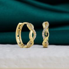 Surprise Mom with timeless elegance this Mother's Day with our Sterling Silver Infinity Huggie Hoop Earrings. Crafted with care, these elegant hoops feature an infinity symbol design, symbolizing everlasting love and connection. Versatile and affordable, they're the perfect accessory for any occasion, adding a touch of sophistication to Mom's ensemble without breaking the bank. Show your love and appreciation with this thoughtful and stylish gift, sure to become a cherished addition to Mom's jew Infinity Symbol Design, Christmas Gift Daughter, Dainty Hoop Earrings, Women Earrings, Mom Jewelry, Unique Christmas Gifts, Stylish Gifts, Jewelry Earrings Hoops, Daughter Gifts