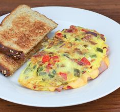 an omelet and toast on a white plate