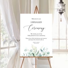 an easel with a sign that says, welcome to our unplugged ceremony