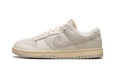 The Nike Dunk Low “Phantom/Light Bone” is a colorway of the retro basketball shoe with an interesting mixture of materials.  On the Dunk Low “Phantom/Light Bone,” the upper features a knit and ribbed textile materials on the midfoot, collar, and tongue panels.  Suede can be found on the perforated toe and heel.  A classic Swoosh logo appears on the sides of the shoe.  Exposed foam padding can be seen on the tongue, giving the shoe a “DIY” vibe.  Underfoot, a Coconut Milk-colored rubber midsole a Nike X Travis Scott, Low Air Jordan 1, Retro Basketball, Bone Shoes, Jordan 8, Adidas Spezial, Dunks Nike, Jordan 2, Nike Dunk High