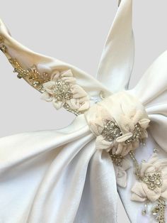 Available for pre-order, the expected ship date is Monday, December 18th. Our most elegant bow is now available in multiple sizes, with stunning hand embroidery for any big event. With hand-crafted flowers that add dimension against a supple silk backdrop, it's a truly standout accessory. Style with a strapless gown or top to highlight the stunning shape. Highlight the pink flower details with nice jewelery. Size 1: 12"-14" Size 2: 14"-16" Silk Backdrop, Crafted Flowers, Tie Length, Strapless Gown, Silk Charmeuse, Floral Bridal, Pink Flower, The Pink, Floral Embroidery