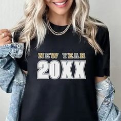 Black happy New Year holiday t-shirt with silver and gold bold lettering.  Great holiday season nye 2024 shirt. Nye 2024, Bold Lettering, Happy New Year 2024, New Year Holidays, Year 2024, Silver And Gold, Gold Glitter, Happy New, Black Silver