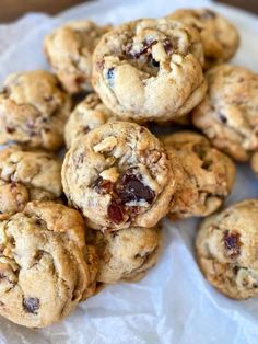 a pile of chocolate chip cookies sitting on top of a table