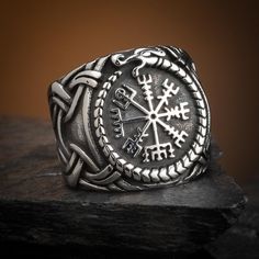 Substantial chunky stainless steel ring featuring a central Vegvisir surrounded by a Jormungand serpent. Available in US sizes 9-13 Viking Style Silver Outdoor Jewelry, Durable Viking Style Jewelry Gift, Handmade Viking Style Jewelry For Outdoor, Viking Style Engraved Ring As Gift, Durable Symbolic Jewelry As A Gift, Symbolic Jewelry As A Gift, Viking Hood, Viking Odin, Norse Myth