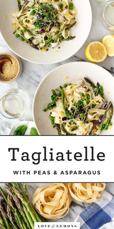 two white bowls filled with pasta and asparagus on top of a marble table