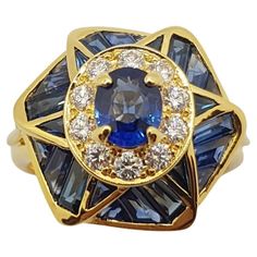 Blue Sapphire 0.75 carat with Blue Sapphire 2.30 carats and Diamond 0.35 carat Ring set in 18 Karat Gold Settings Width: 1.6 cm Length: 1.6 cm Ring Size: 54 Total Weight: 8.24 grams "We first opened doors in 1980 when it was then situated in the vicinity of the Victory Monument; a small and modest storefront with a couple of counters. From its humble beginnings to where it stands today, our company has proven its abilities as a jeweler. Since the beginning, we have been supplying fine quality pi Blue Sapphire Ring With Multi-stone Baguette Cut, Blue Sapphire Multi-stone Baguette Ring, Blue Multi-stone Baguette Cut Sapphire Ring, Blue Sapphire Diamond Ring, Diamond Watches For Men, Diamond Ring Set, Blue Sapphire Diamond, Diamond Ring Settings, Gold Ring Sets