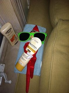 an elf's hat, sunglasses and sunscreen on a couch