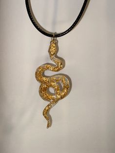 A beautiful handmade snake pendant. A great gift for a loved one or yourself! Each pendant is unique and one of a kind. This necklace is lightweight, durable. The black necklace cord is 45cm in length with a silver lobster claw clasp and 5cm extension chain, you can adjust the length to fit your needs. Other colours available in my store and more coming soon. If you have any request for any specific colour(s) or themes, feel free to contact me and I will see what I can do. :)  Custom orders avai Black Snake Necklace For Gifts, Black Snake Necklace For Gift, Black Snake-shaped Necklaces As Gift, Black Snake Shape Necklace Gift, Black Snake Shape Necklace For Gift, Unique Adjustable Snake Chain Necklace, Spiritual Snake-shaped Necklace For Gifts, Handmade Snake-shaped Necklace For Gift, Handmade Snake Shape Necklace Gift