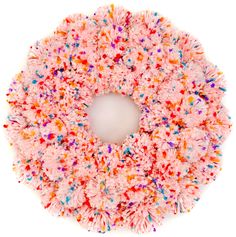 a pink wreath with multicolored sprinkles on the front and sides